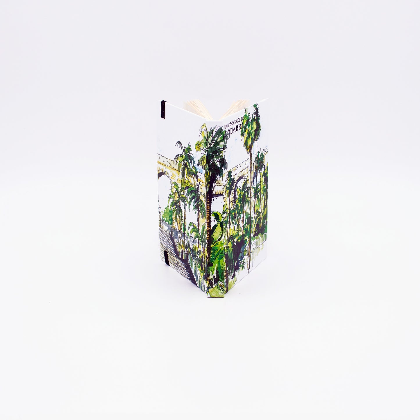 Bloco de Notas A6 com folhas lisas, decorado com uma ilustração da Entrada do Jardim Botânico da Universidade de Coimbra, da autoria do artista João Abel Mota