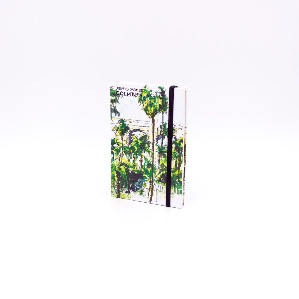 Bloco de Notas A6 com folhas lisas, decorado com uma ilustração da Entrada do Jardim Botânico da Universidade de Coimbra, da autoria do artista João Abel Mota