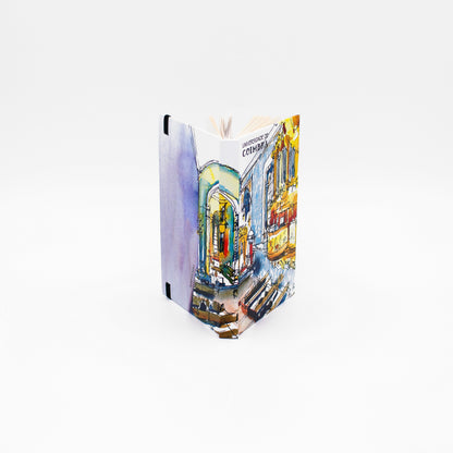 Bloco de Notas A6 com folhas lisas, decorado com a bela ilustração da Capela de S. Miguel da Universidade de Coimbra, da autoria do artista Pedro Loureiro.