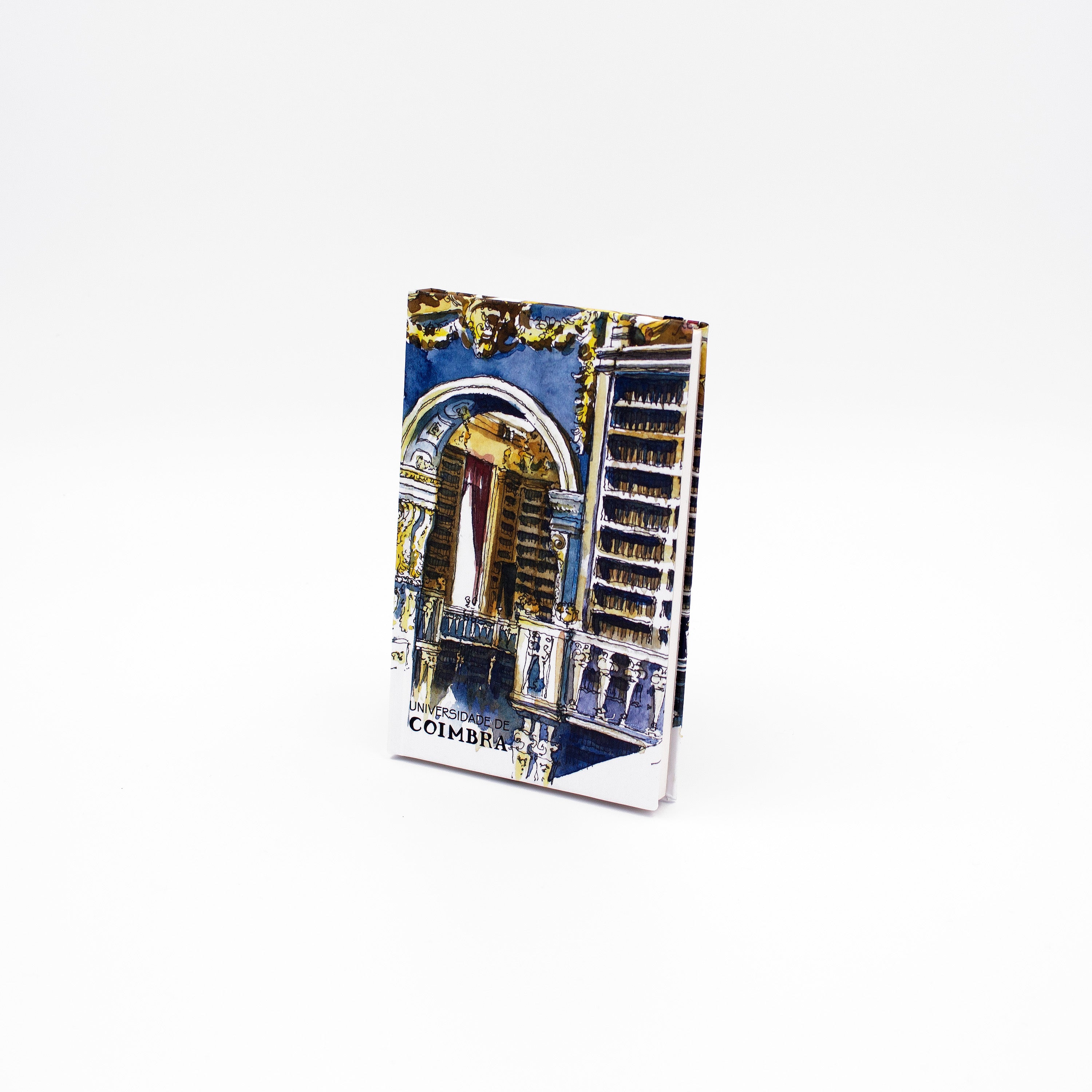 Bloco de notas A5 com folhas lisas, decorado com a ilustração da Biblioteca Joanina da Universidade de Coimbra, da autoria de João Abel Mota