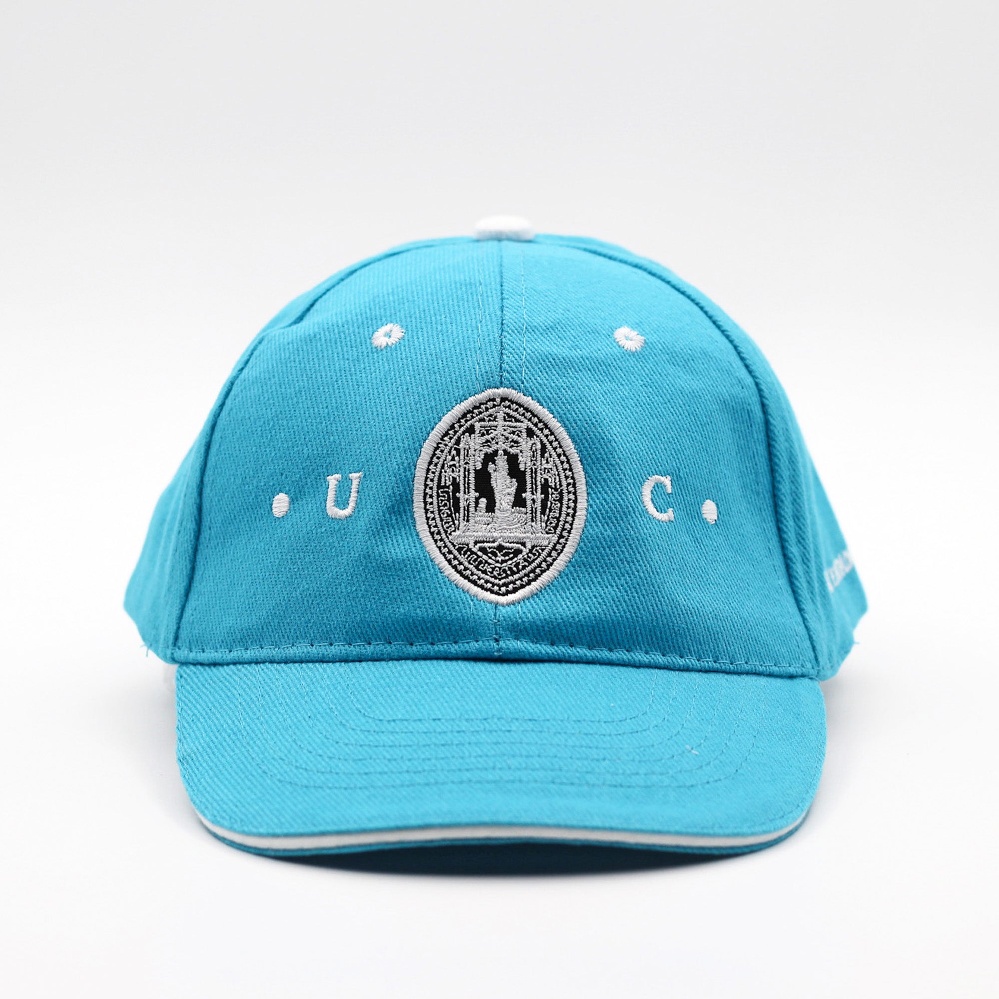 Boné Azul para criança com a insígnia da Universidade de Coimbra.