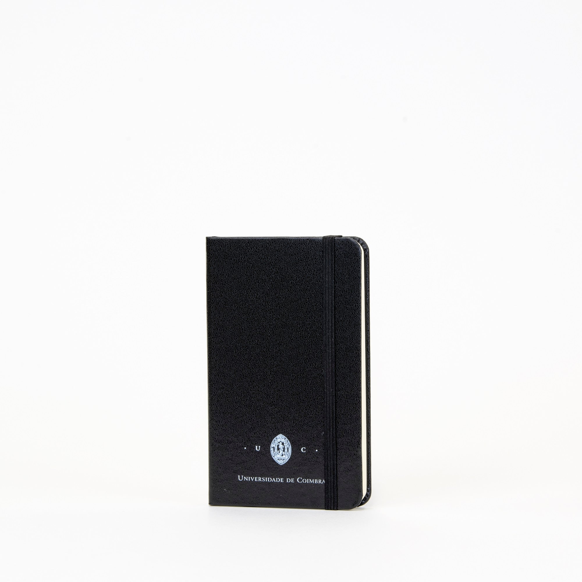 Bloco A6 de folhas lisas, com destaque da insígnia da Universidade de Coimbra.